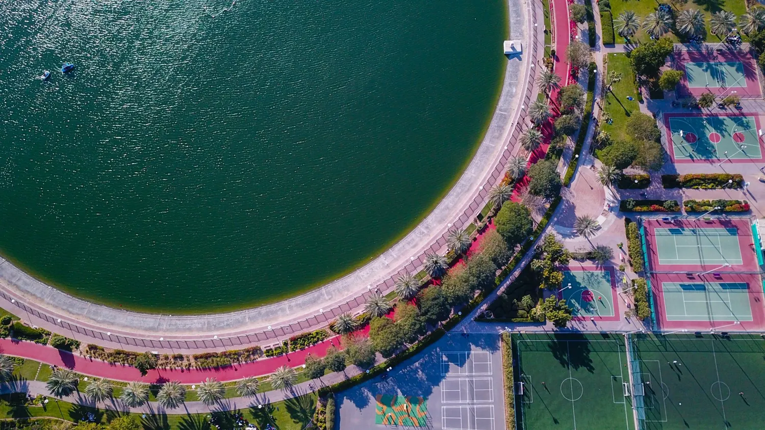 Outdoor sports courts in a landscaped park