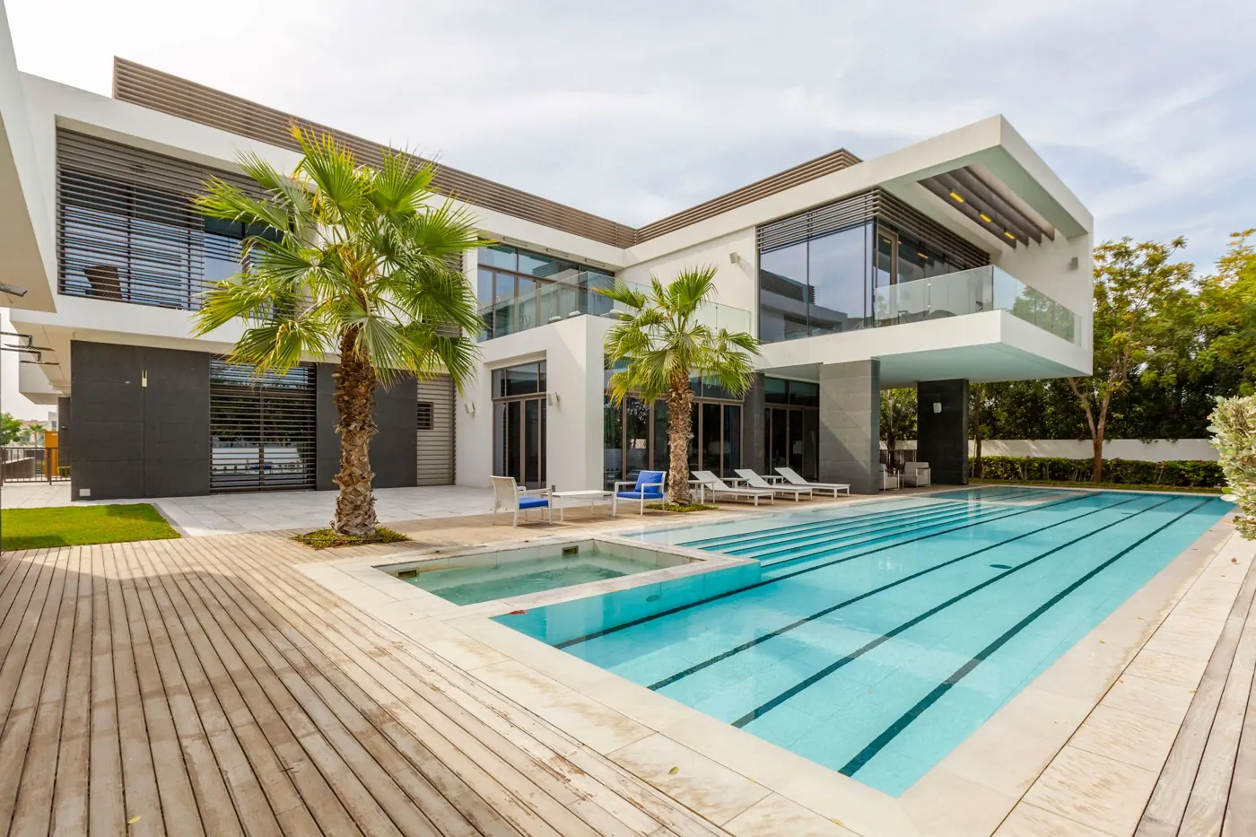 Luxury villa with a pool framed by palm trees